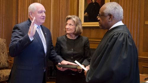 Flanked by his wife, Mary, former Georgia Gov. Sonny Perdue is sworn in as the 31st secretary of agriculture by Supreme Court Justice and Georgia native Clarence Thomas. PHOTO: With permission from USDA/Cabinet Communications.
