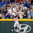Atlanta Braves outfielder Michael Harris II (23) can't reach a home run hit by the Cubs’ outfielder Seiya Suzuki (27) in the eighth inning at Truist Park on Wednesday, May 15, 2024. Chicago won 7-1. (Arvin Temkar / AJC)