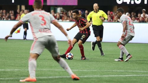 Atlanta United midfielder Gonzalo MartAnez (10) moves the ball during the first half in a MLS game against the New York City Red Bulls on Sunday, July 7, 2019, in Atlanta. BRANDEN CAMP/SPECIAL