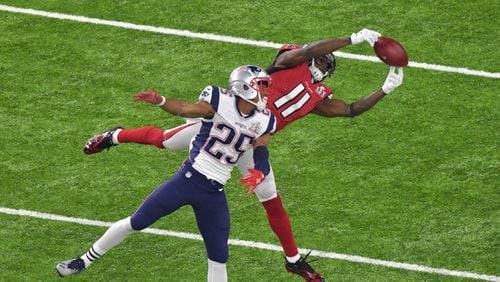 Falcons WR Julio Jones (11) extends to make a catch over Patriots CB Eric Rowe (25) in the second half of the Super Bowl in February. Hyosub Shin/hshin@ajc.com