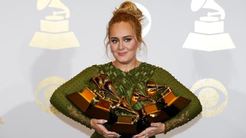 Adele and her armload of Grammys. (Allen J. Schaben/Los Angeles Times/TNS)