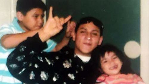 This family photo shows Richard Tavera with younger family members. Tavera, who was bipolar and had a history of depression, committed suicide in 2014 in a Georgia prison.