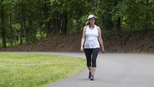 Duluth resident Debbie Proenza walks the trails at McDaniel Farm Park in Duluth, Monday, May 7, 2018. Debbie has lived in Duluth for more than 10 years and says she enjoys living near the park. ALYSSA POINTER/ALYSSA.POINTER@AJC.COM