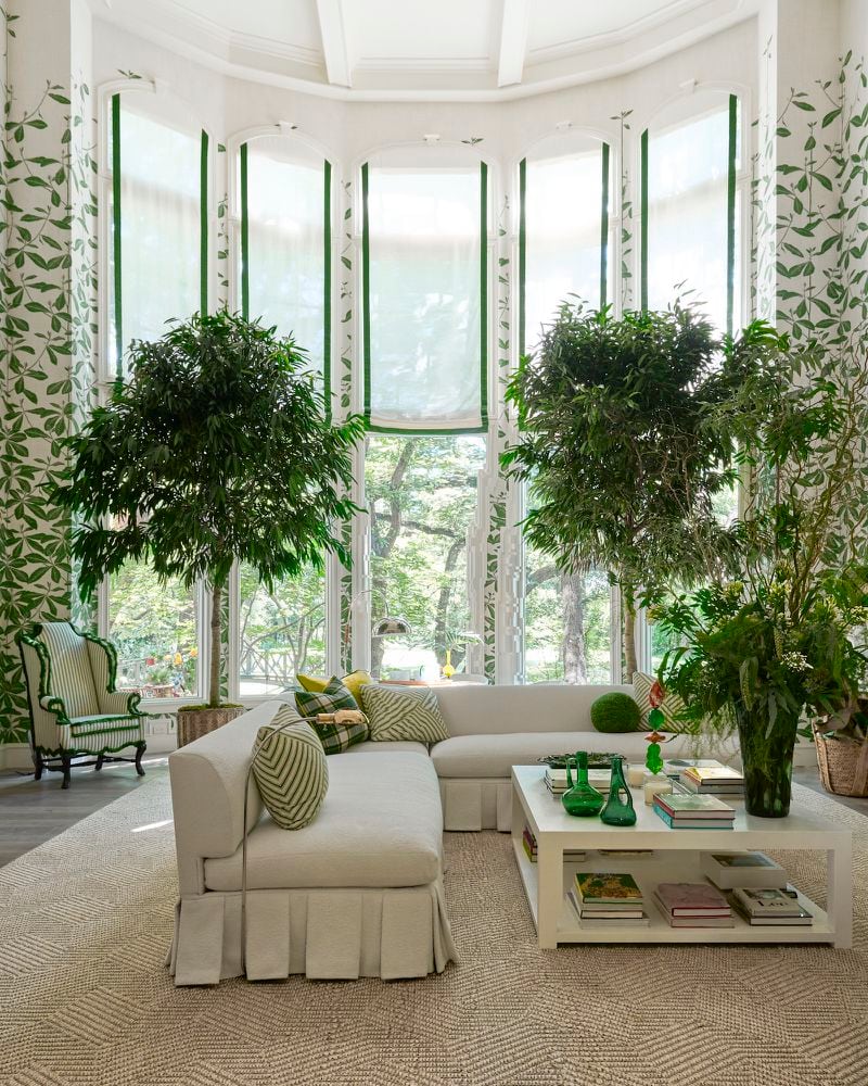 It's hard to imagine a room that better illustrates the tenets of biophilia than Chicago designer Alessandra Branca's living room for the 2022 Kips Bay Dallas Show House which combines ample light, plants, green accessories and botanical wallpaper to create the sensation of living in a forest. Courtesy of Jay Simon of Ten Ten Creative