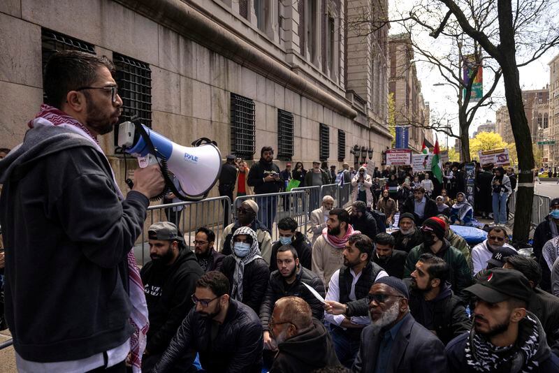 People gather for the "Solidarity Jummah" outside the Columbia University, Friday, April 26, 2024, in New York. (AP Photo/Yuki Iwamura)