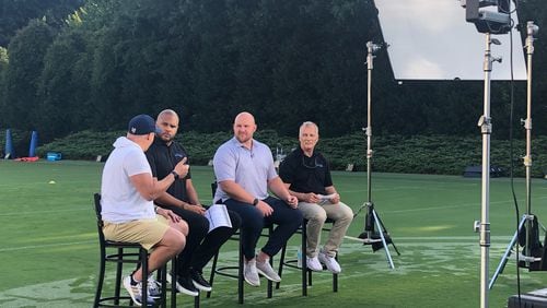 ACC Network analysts (from right to left) Mark Richt, Eric Mac Lain and Jordan Cornette listen to Georgia Tech coach Geoff Collins (in white shirt and shorts) during a taping of a program previewing Tech's season. (AJC photo by Ken Sugiura)