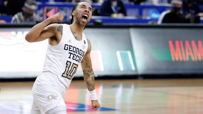 Georgia Tech's Jose Alvarado (10) celebrates in the final seconds of the Yellow Jackets' 70-66 victory over Miami in the quarterfinal round of the ACC Tournament Thursday, March 11, 2021, in Greensboro, N.C. (Ethan Hyman/The News & Observer)