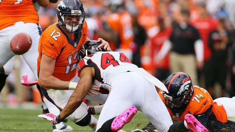Broncos quarterback Paxton Lynch eyes a loose ball after outside linebacker Vic Beasley of the Falcons caused him to fumble in the third quarter of the game at Sports Authority Field at Mile High on Oct. 9, 2016 in Denver. Broncos recovered the ball. (Photo by Justin Edmonds/Getty Images)