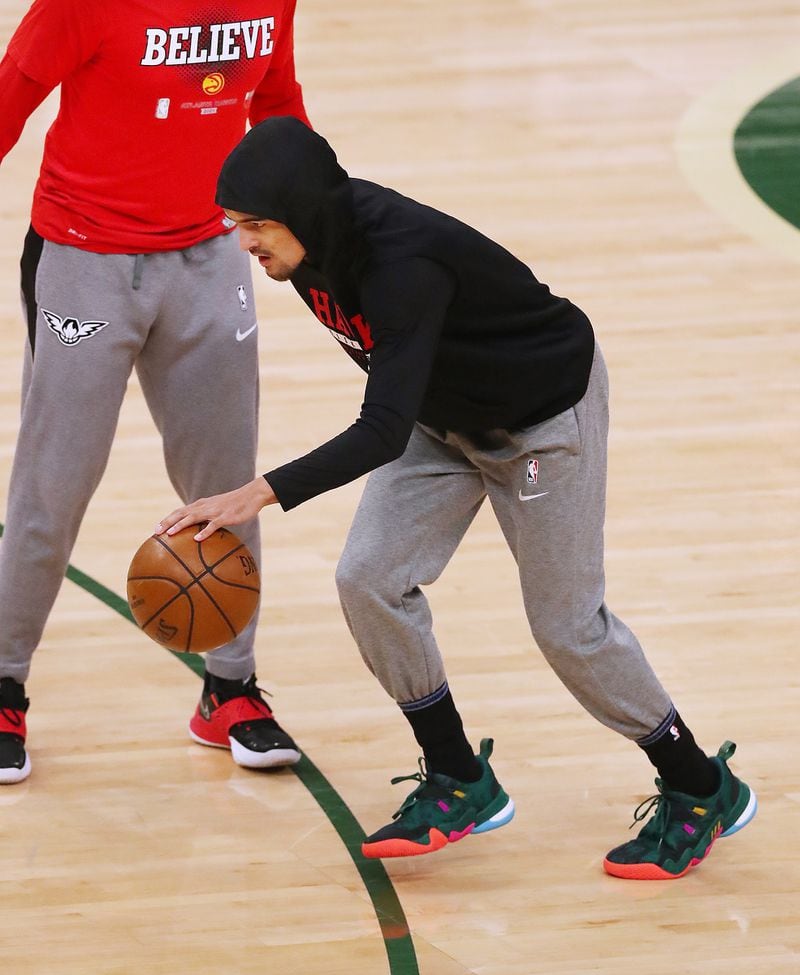 Hawks guard Trae Young tests out the bone bruise in his right ankle two hours before tip off against the Milwaukee Bucks.   “Curtis Compton / Curtis.Compton@ajc.com”