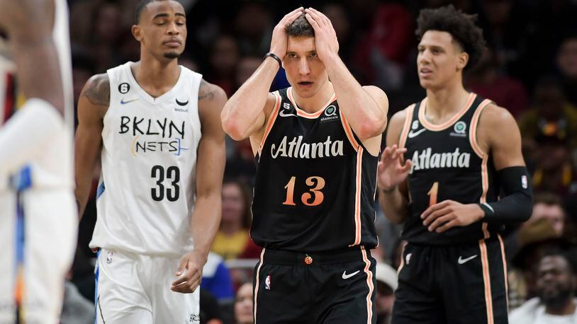 Atlanta Hawks’ guard Bogdan Bogdanovic (13) reacts to a basket scored by the Brooklyn Nets during the first half of an NBA basketball game at State Farm Arena on Wednesday, December 28, 2022. (Daniel Varnado/For the AJC) 