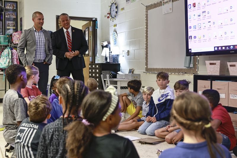 Kemp Elementary Principal Billy Pritz (left) and Cobb County Superintendent Chris Ragsdale (right) talk to students in a third grade class on Monday, Aug. 1, 2022. (Natrice Miller/natrice.miller@ajc.com)