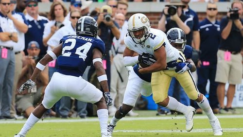 Ricky Jeune #2 of the Georgia Tech Yellow Jackets is tackled by Darius Jones Jr. #5 and Sean Freeman #24 of the Georgia Southern Eagles during the first half at Bobby Dodd Stadium on October 15, 2016 in Atlanta, Georgia. (Photo by Daniel Shirey/Getty Images)