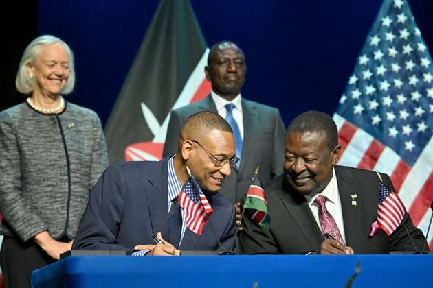 Clinton White (foreground left), U.S. Counselor for USAID, and Musalia Mudavadi, Prime Cabinet Secretary of Kenya, sign MOU as President of the Republic of Kenya, Dr. William Samoei Ruto (background right) and U.S. Ambassador to Kenya Margaret “Meg” Whitman (background right) react during an event hosted by Spelman College, Tuesday, May 21, 2024, in Atlanta. Spelman College hosted the President of the Republic of Kenya, Dr. William Samoei Ruto for a series of events focused on developing a technology bridge between Historically Black Colleges and Universities (HBCUs) and Kenyan scholars in order to lay the groundwork to prepare a generation of future leaders to meet ever-evolving market demands. (Hyosub Shin / AJC)