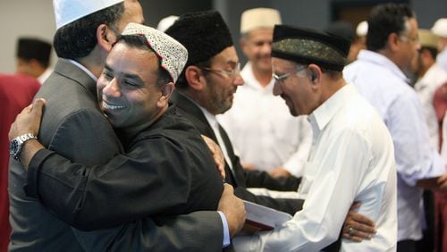 The Ahmadiyya Muslim community in Georgia observed the Muslim holiday of Eid Mubarak with family and friends at Lucky Shoals Park in Norcross several years ago. The motto of the Ahmadiyya Community is “Love for All, Hatred for None.” AJC FILE PHOTO 2012