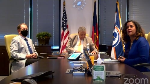 (Left to right) Fulton County Manager Dick Anderson, Fulton Commission Chairman Robb Pitts and Fulton's director of customer experience and solutions Brigitte Bailey all take questions from the media via Zoom on Aug. 10 ahead of the Aug. 11 runoff election.