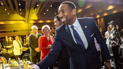 Atlanta Mayor Andre Dickens enters the annual State of the City Business Breakfast at the Georgia World Congress Center on Monday, April 4, 2022.  Former Mayors Andrew Young, Shirley Franklin and Keisha Lance Bottoms were in attendance.  (Jenni Girtman for The Atlanta Journal-Constitution)
