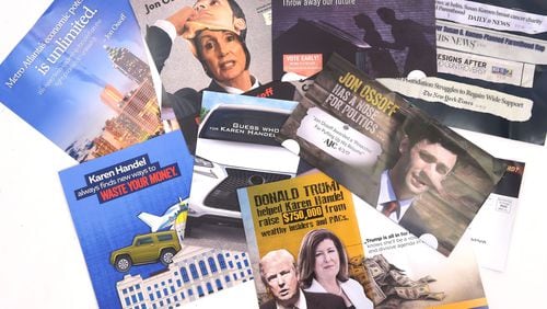 Campaign mailers for 6th District candidates Jon Ossoff and Karen Handel. KENT D. JOHNSON / AJC