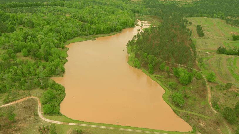 An aerial photo captured on April 9, 2023 shows a lake on the property of Shaun and Amie Harris in Stewart County, Georgia turned red by sediment runoff. (Courtesy of Shaun Harris)