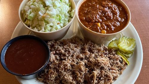 Old South Bar-B-Q’s Cole Slaw alongside the restaurant’s Brunswick stew, chopped BBQ pork and a dish of their original barbecue sauce.  
Courtesy of Joy Llewallyn