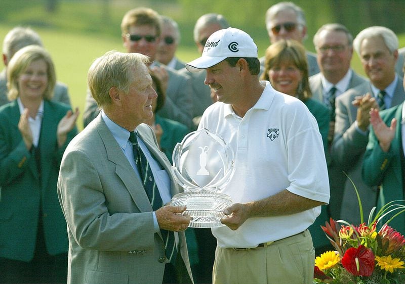 Jack Nicklaus presents the trophy to Bart Bryant Sunday, June 5, 2005 during the award ceremony of the Memorial Tournament at the Muirfield Village Golf Club in Dublin, Ohio. (AP Photo/Chris Putman)