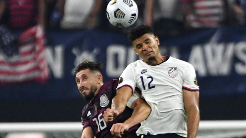 Mexico midfielder Hector Herrera (16) and U.S. defender Miles Robinson (12), of Atlanta United, go to head the ball during the second half of the CONCACAF Gold Cup final soccer match Sunday, Aug. 1, 2021, in Las Vegas. (David Becker/AP)