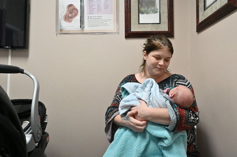 Joy Holder holds her 16-day old son Prince Jasper Lee Holder as she waits for Dr. Jeffrey Harris at Wayne Obstetrics and Gynecology in Jesup on Feb. 6, 2020. Holder won’t have health insurance once her Medicaid expires this spring. (Hyosub Shin / Hyosub.Shin@ajc.com)