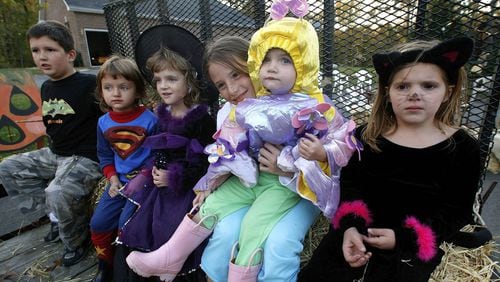FILE PHOTO: Young children dressed in various costumes get ready for a hay ride during a Halloween party October 28, 2006 in Huntingtown, Maryland.