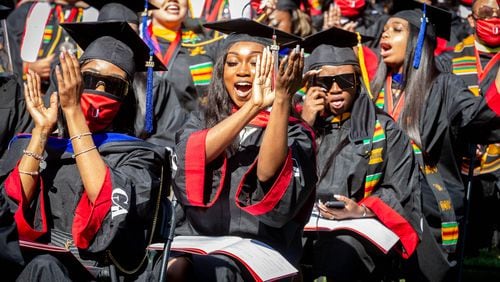 Members of the Clark Atlanta University 2020 graduating class celebrate during the Saturday ceremony at the Harkness Hall Quadrangle in Atlanta May 15, 2021. The 2020 ceremony was postponed because of the COVID-19 pandemic. (Photo: Steve Schaefer for The Atlanta Journal-Constitution)