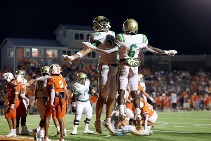 August 20, 2021 - Kennesaw, Ga: Buford running back Victor Venn (6) celebrates his rushing touchdown with Callum Fraser (15) during the second half against North Cobb at North Cobb high school Friday, August 20, 2021 in Kennesaw, Ga.. Buford won 35-27. JASON GETZ FOR THE ATLANTA JOURNAL-CONSTITUTION
