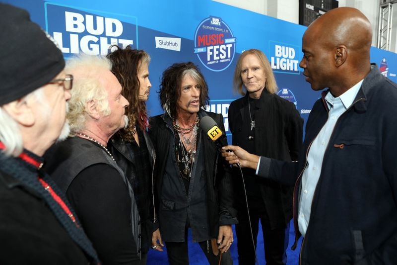 Aerosmith chats with Entertainment Tonight on the blue carpet before their performance at the Super Bowl Music Fest at State Farm Arena.  Photo: Robb Cohen Photography & Video /RobbsPhotos.com