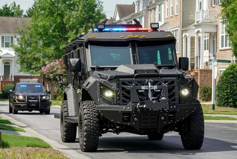 A SWAT vehicle is driven through the Whittington Townhome community Tuesday during a standoff with a man barricaded inside a residence. (Photo: Ben Hendren)