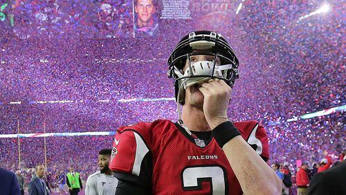 Falcons quarterback Matt Ryan reacts to losing the Super Bowl as the screen flashes Patriots quarterback Tom Brady and confetti flies in a 34-28 loss on Sunday Feb. 5, 2017, in Houston.