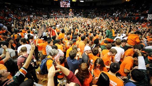 Miami fans storm the court at the end of the game of a men's college basketball game at the BankUnited Center in Coral Gables, Florida, Wednesday, January 23, 2013. Miami defeated Duke, 90-63.