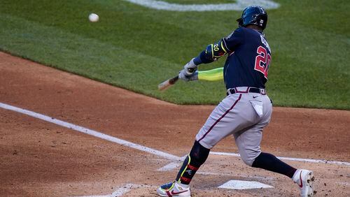 Atlanta Braves' Marcell Ozuna hits a grand slam during the third inning of the team's baseball game against the Washington Nationals at Nationals Park, Wednesday, May 5, 2021, in Washington. (AP Photo/Alex Brandon)