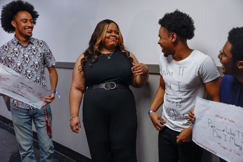 Internet personality Tareasa Johnson (second from left) known online as Reesa Teesa, talks to Morehouse College students Braxton Broady (left) Kullen Gilliam and Kaden Shaw during CultureCon on the campus of Clark Atlanta University on Friday, April 12, 2024. Johnson went viral after creating a 50-part Tik Tok series “Who TF Did I Marry” where she details  her experience six-month marriage to a man that she says was a pathological liar. (Natrice Miller/ AJC)