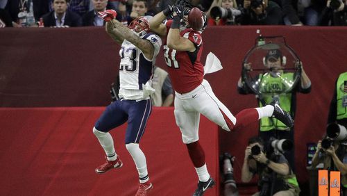 New England Patriots' Patrick Chung (23) breaks up a pass intended for Atlanta Falcons' Austin Hooper during the first half of the NFL Super Bowl 51 football game Sunday, Feb. 5, 2017, in Houston. (AP Photo/Jae C. Hong)