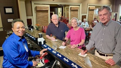 Bartender Afi Jones (from left) and Park Springs Foundation Board members Ross Lenhart, Missy Vanderbilt and Jim Stark. Park Springs retirement community formed a nonprofit to assist employees and their families with educational financial support. Courtesy of Cristina Anderson