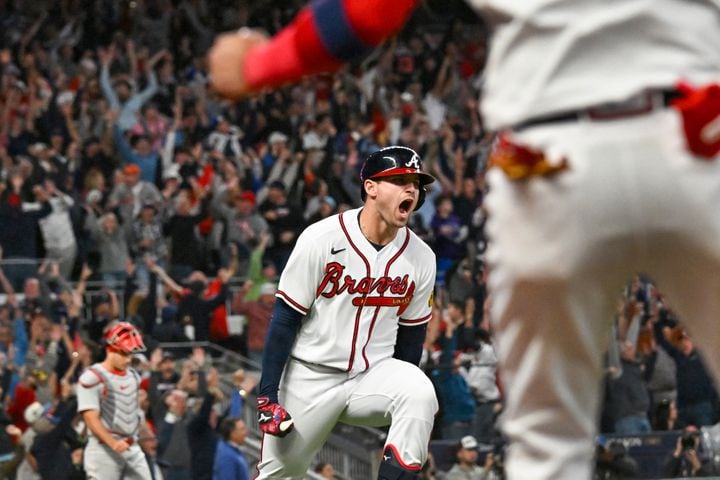 Atlanta Braves’ Austin Riley (27) celebrates his two-run home run against the Philadelphia Phillies during the eighth inning of NLDS Game 2 in Atlanta on Monday, Oct. 9, 2023. The Braves won 5-4.  (Hyosub Shin / Hyosub.Shin@ajc.com)