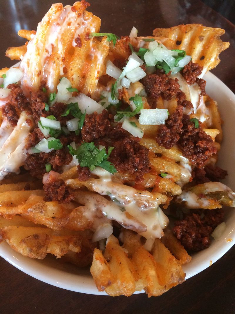 Lean Draft House’s Chorizo Cheesy Fries is bar food at its best. CONTRIBUTED BY WENDELL BROCK