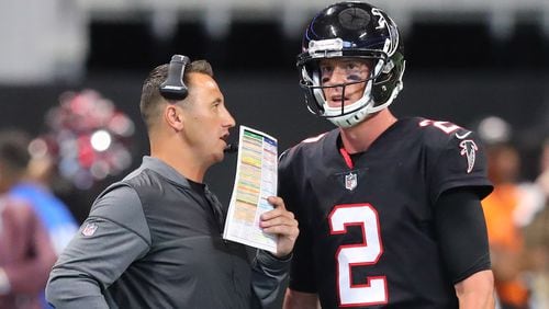 Falcons offensive coordinator Steve Sarkisian confers with quarterback Matt Ryan during a time out in the second half against the Bills in a NFL football game on Sunday, October 1, 2017, in Atlanta.   Curtis Compton/ccompton@ajc.com