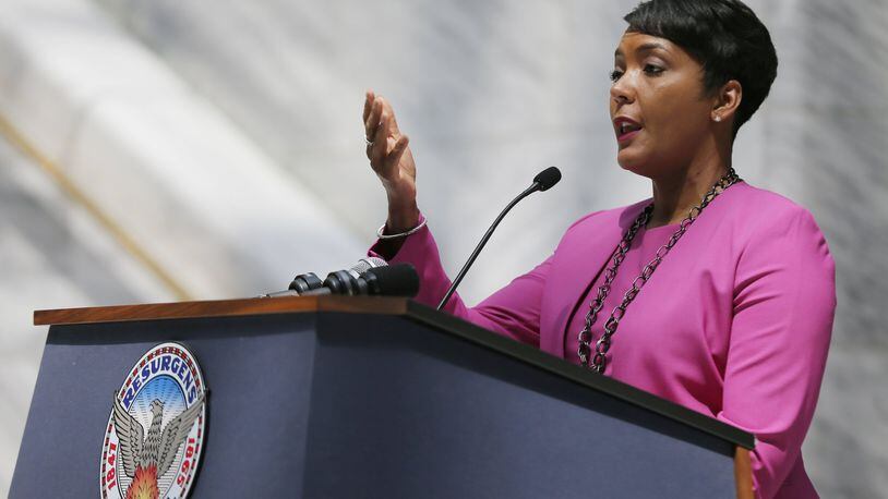 Mayor Keisha Lance Bottoms, shown here at a press conference April 10, said earlier that a city education officer doesn’t signal city hall’s desire to take over schools. “I think that there has to be someone each and every day focused on education, knowing that APS leads the efforts on behalf of our communities,” she said. Bob Andres bandres@ajc.com