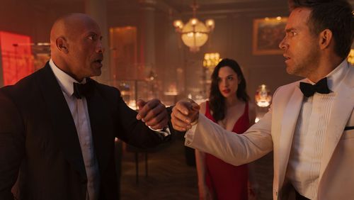 Netflix's thriller "Red Notice" stars Dwayne Johnson, Gal Gadot and Ryan Reynolds. It comes out Friday. NETFLIX