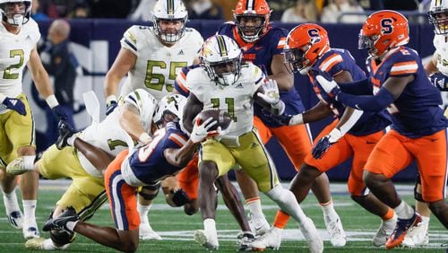 Georgia Tech Yellow Jackets running back Jamal Haynes (11) has the ball stripped and fumbles during the second half of an NCAA college football game between Georgia Tech and Syracuse in Atlanta on Saturday, Nov. 18, 2023.  Georgia Tech won, 31 - 22. (Bob Andres for the Atlanta Journal Constitution)