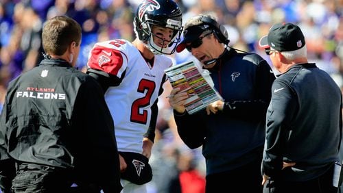 Former Falcons offensive coordinator Dirk Koetter, here with Matt Ryan and former Falcons coach Mike Smith (right), was fired as head coach at Tampa Bay. (Rob Carr/Getty Images