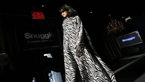 A sleeved blanket is modeled in the Snuggie fall 2009/winter 2010 collection show during Fashion Week Tuesday, Sept. 15, 2009 in New York. (AP Photo/Jason DeCrow)
