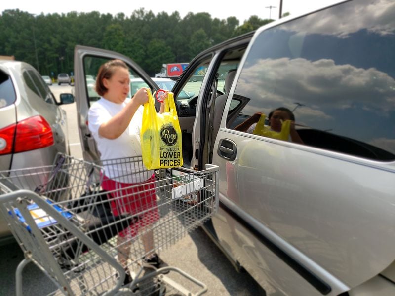 Kroger customer Patricia Lux in Norcross said the chain’s move to drop the use of disposable plastic bags at checkout lines is “a good idea for the planet.” 