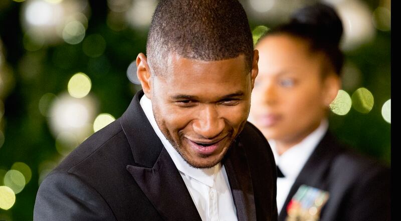 Usher arrives. AP Photo/Andrew Harnik