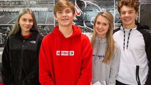 Anna Caputo (from left), Sutton Cadman, Gracie Chaves and Carson Hucks are part of the Alexander High School Habitat for Humanity chapter in Douglasville that is leading their community to raise $90,000 to build a home for a veteran. (Photo by Phil Skinner)