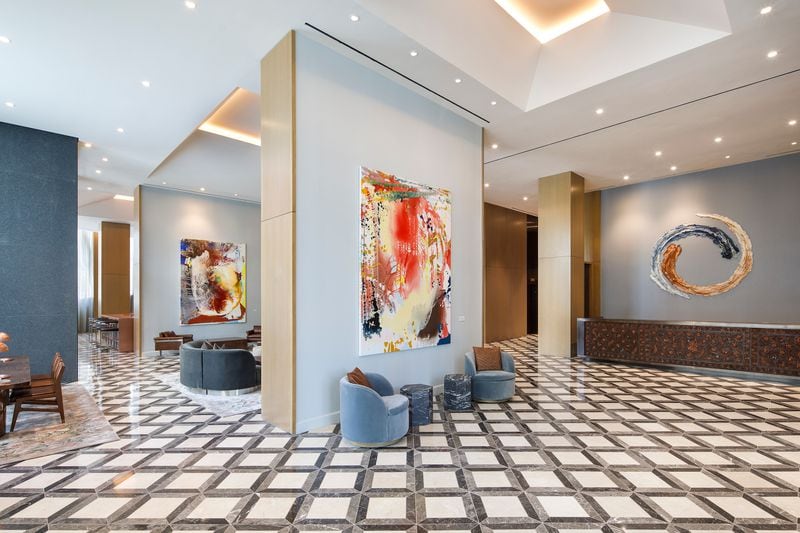Lobby of The Joseph, a Luxury Collection Hotel, Nashville, with paintings by Jackie Saccoccio, ceramics by Brie Ruais and a hand-crafted leather reception desk by Lucchese.