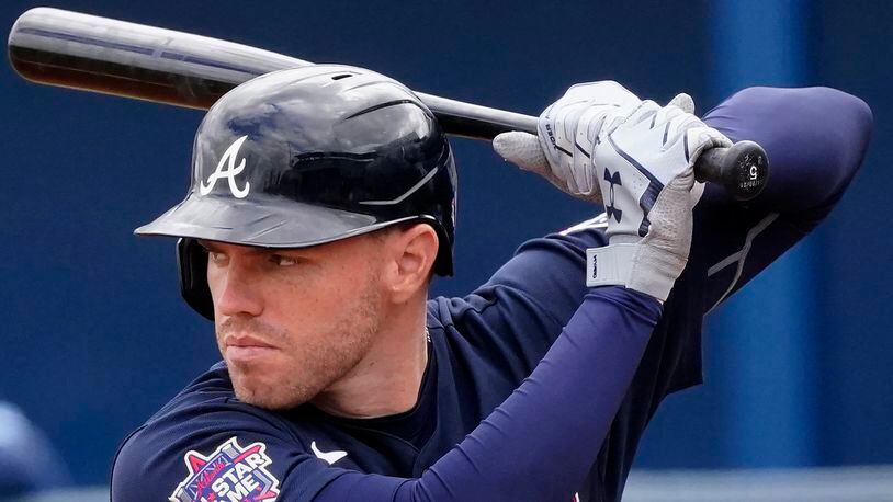 Atlanta Braves first baseman Freddie Freeman (5) bats against the Tampa Bay Rays during a spring training game Sunday, March 21, 2021, in Port Charlotte, Fla. (John Bazemore/AP)
